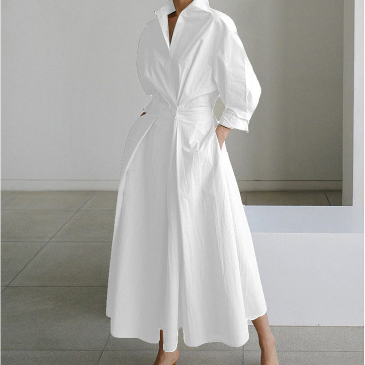 White collared maxi dress with cinched waist and voluminous skirt