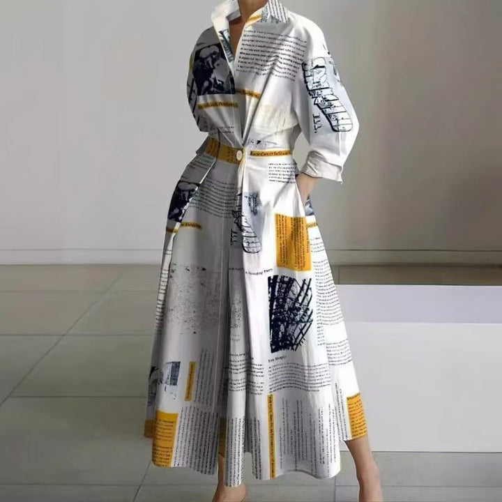 Newspaper print maxi dress with collared neckline and pleated skirt