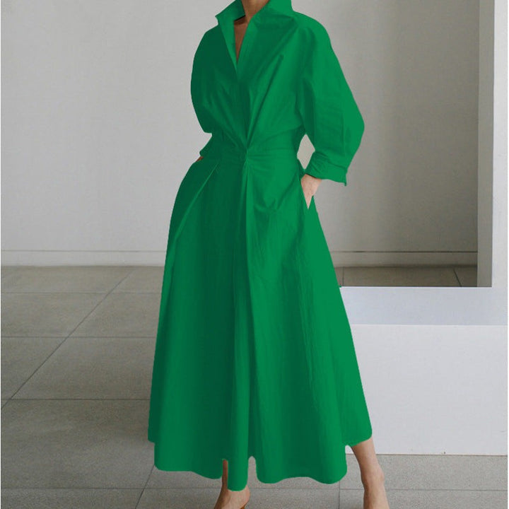 Green collared maxi dress with cinched waist and flowing pleated skirt