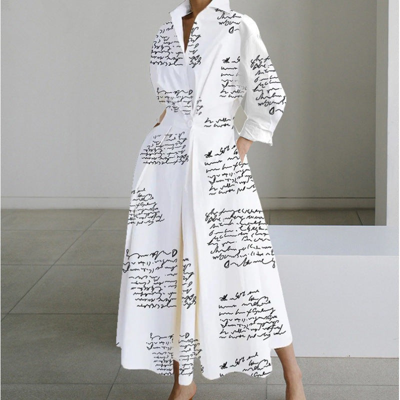 White maxi dress featuring handwritten script print and cinched waist