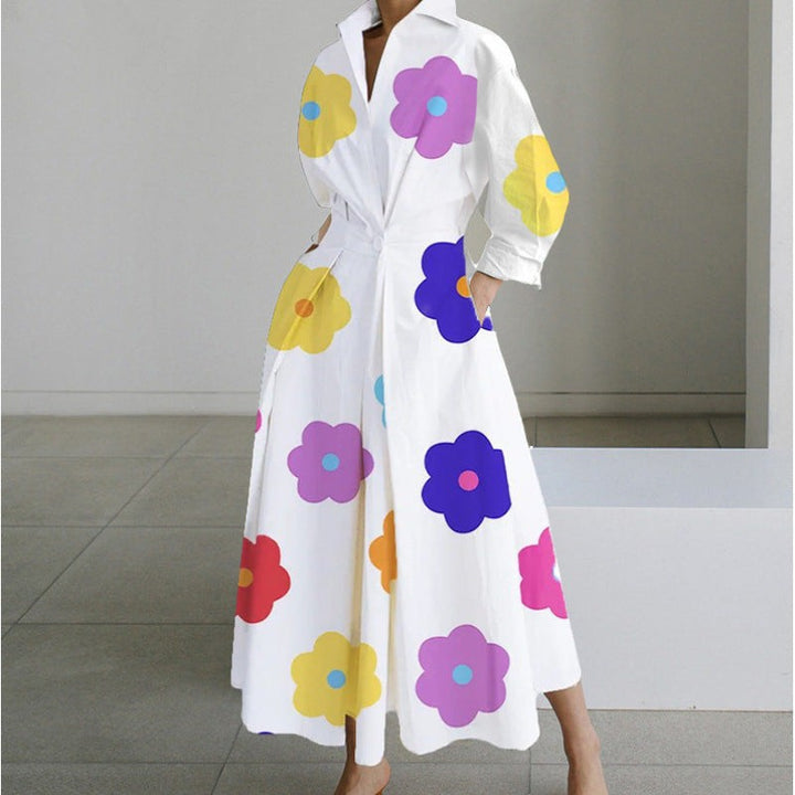 White maxi dress with vibrant multicoloured flower print and long sleeves