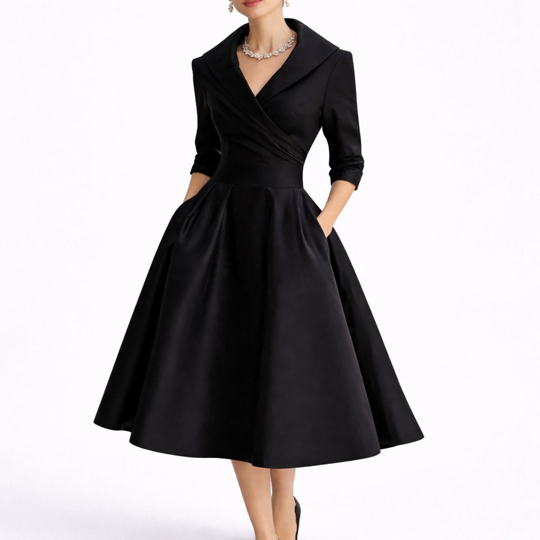 Black satin midi dress with wrap collar and full pleated skirt