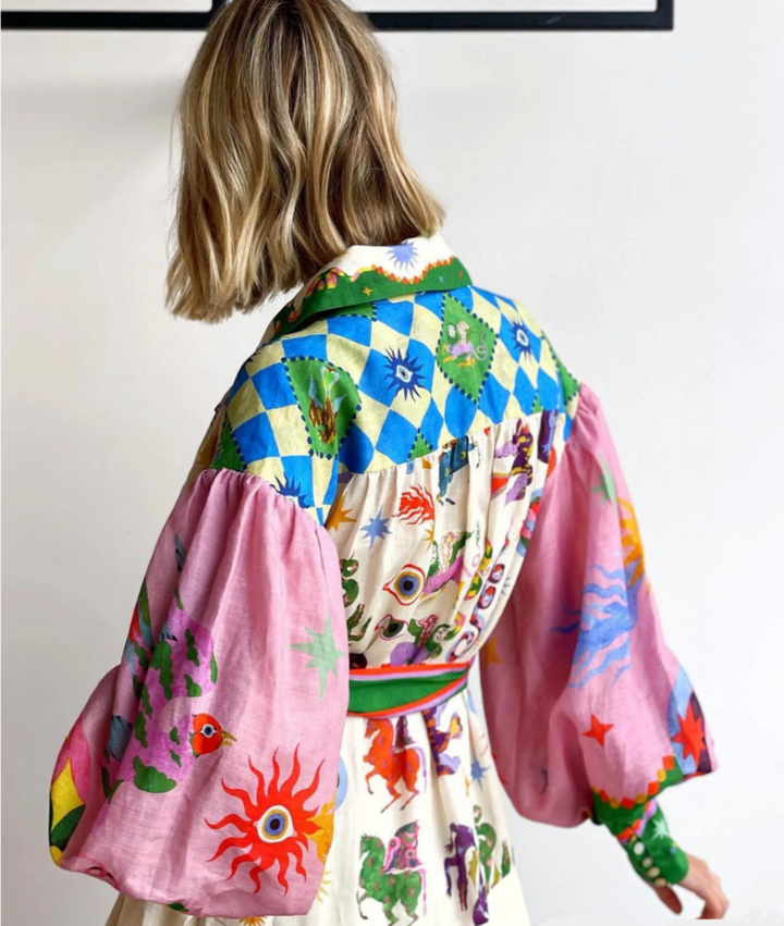 Rear view of maxi dress with pink balloon sleeves and diamond-print yoke