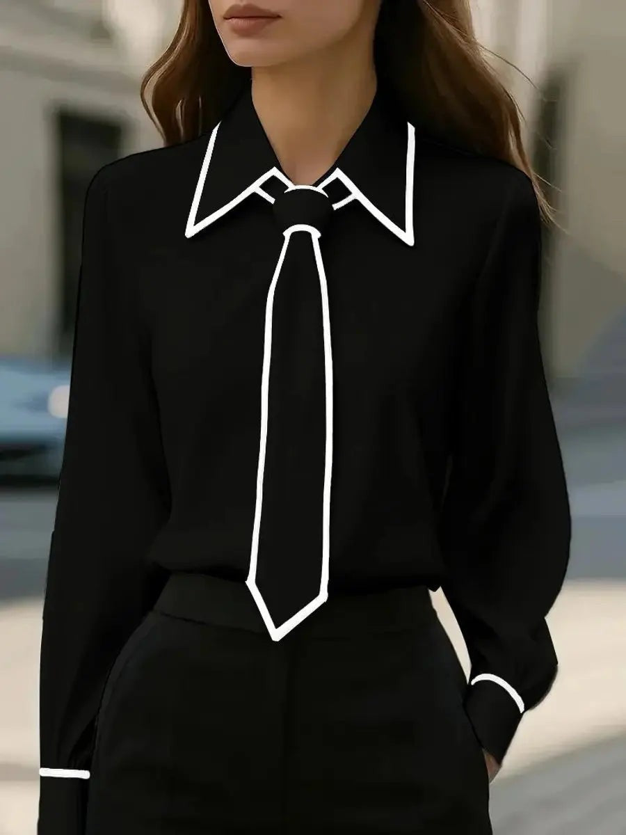 Black tie-neck blouse with contrasting white trim on collar and cuffs