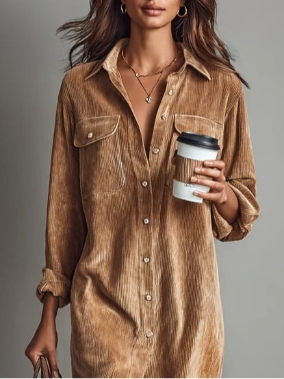 Close-up of camel corduroy shirt dress showing ribbed texture and buttons