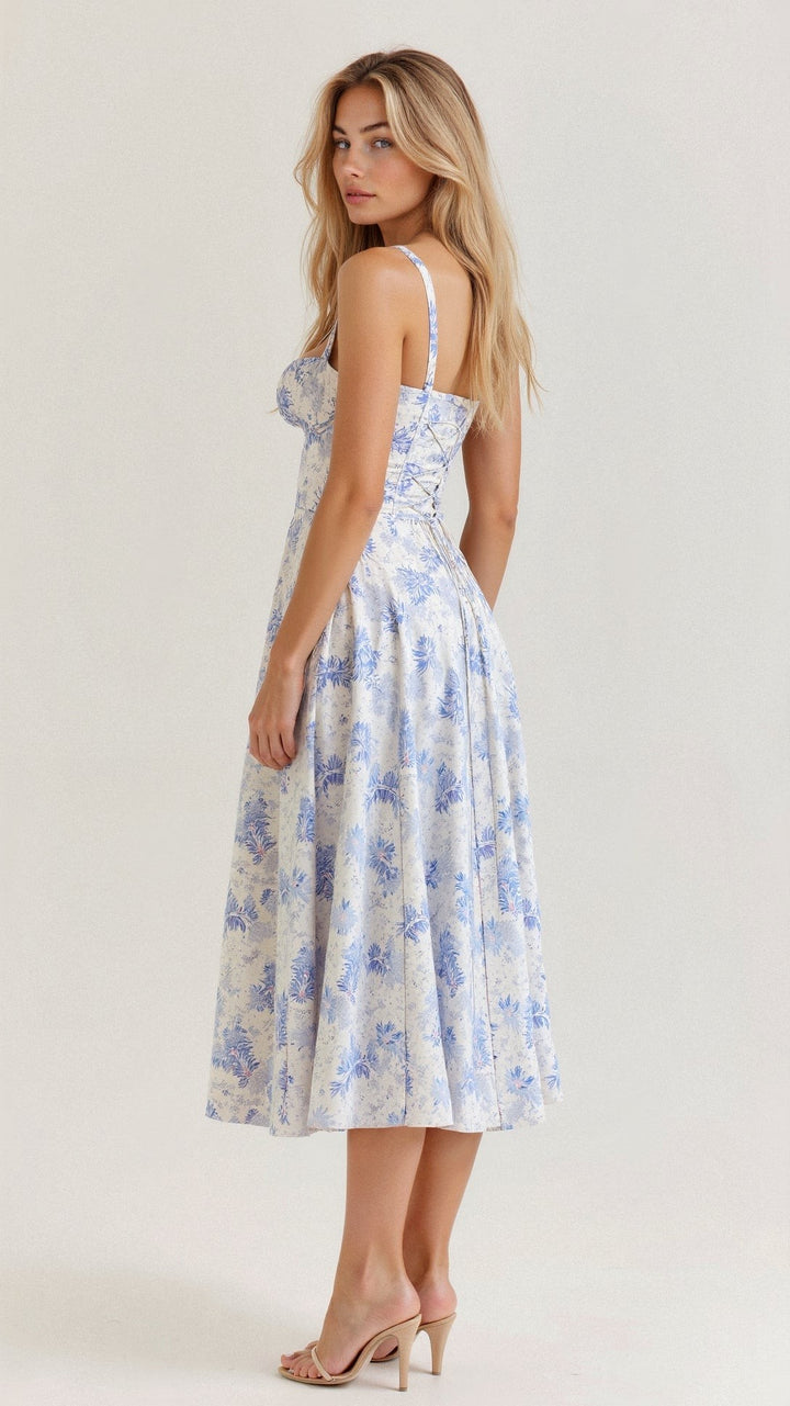Back view of blue floral corset midi dress with lace-up back and flared skirt