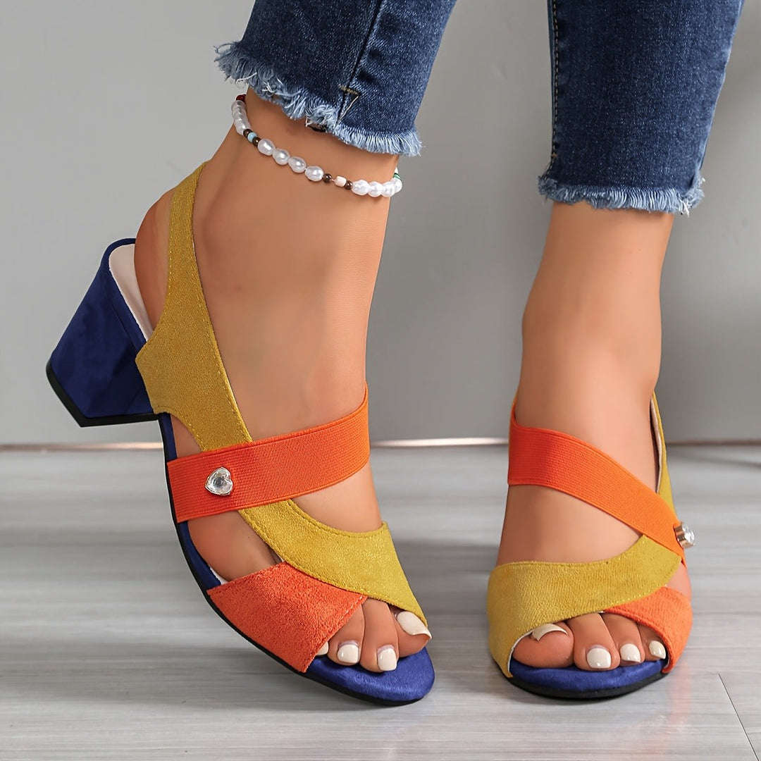 Yellow and orange sandal with crossover elastic straps and chunky navy heel