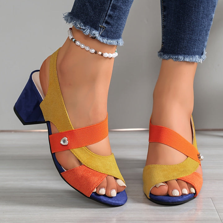 Yellow and orange sandal with crossover elastic straps and chunky navy heel