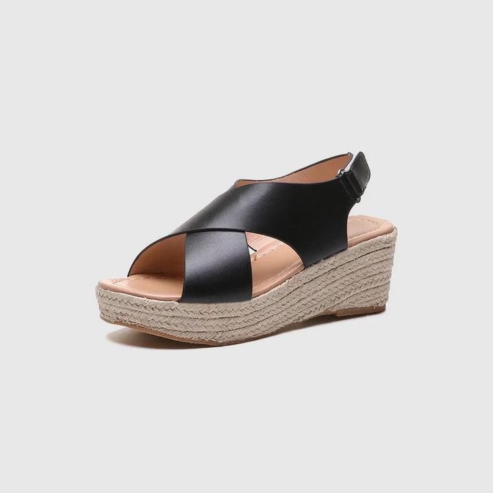 Black leather crossover wedge sandal with woven espadrille platform sole