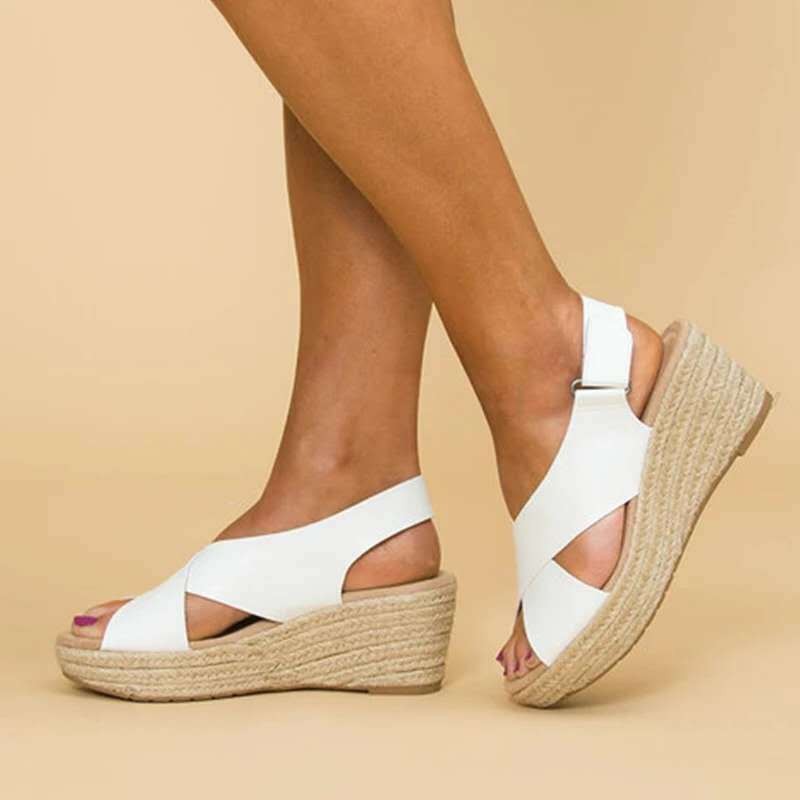 White espadrille wedge sandals with slingback strap, rear angled view