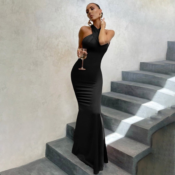 Black halterneck maxi dress with fishtail hem and asymmetric neckline