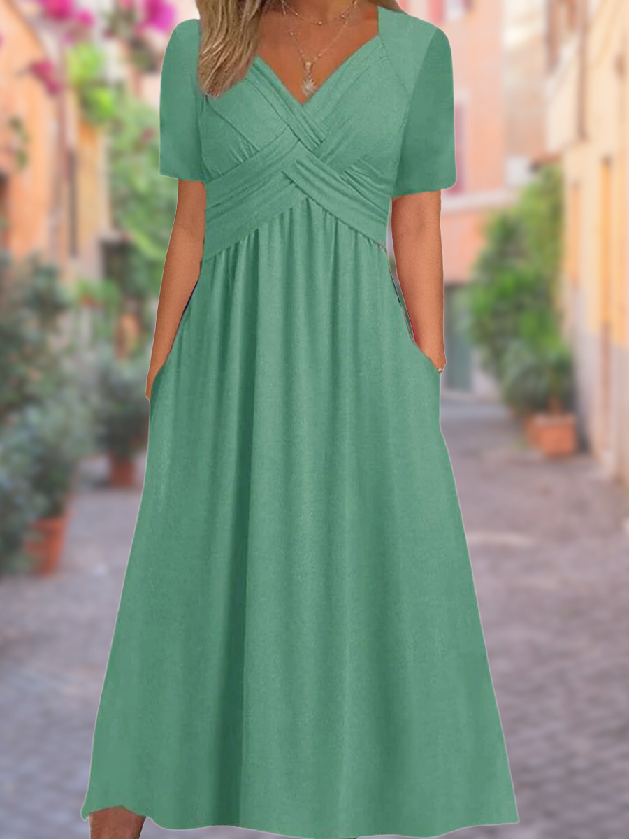 Sage green midi dress with crossover bust and empire waistline