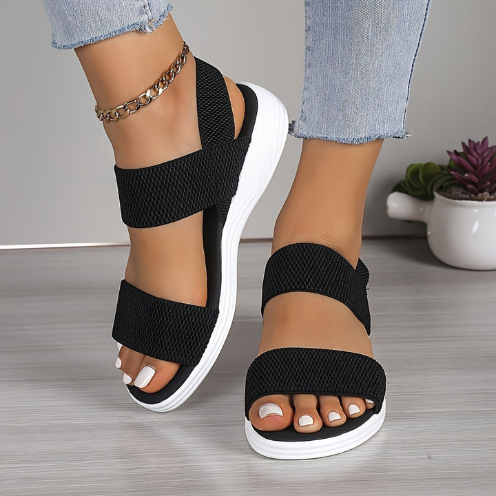 Navy woven double-strap sandals with white chunky platform sole