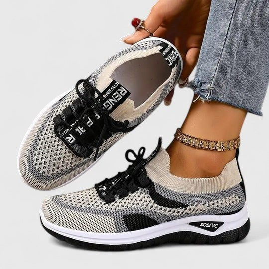 Beige and black mesh trainers with knit upper and lace-up fastening