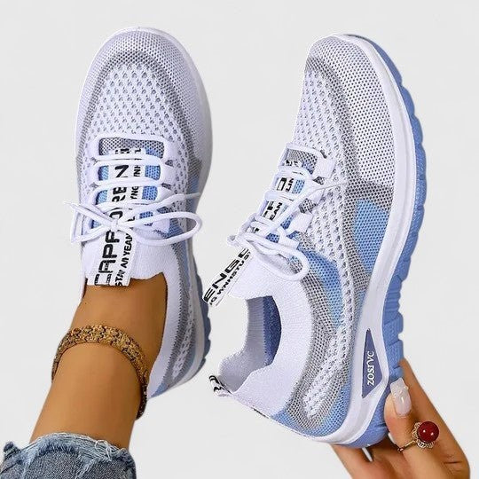 White mesh trainers with sky blue panels and sporty lace-up styling