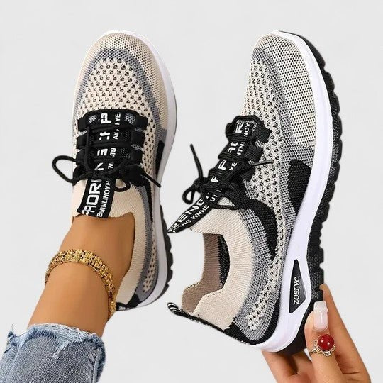 Black and beige mesh trainers featuring lace-up front and thick white sole