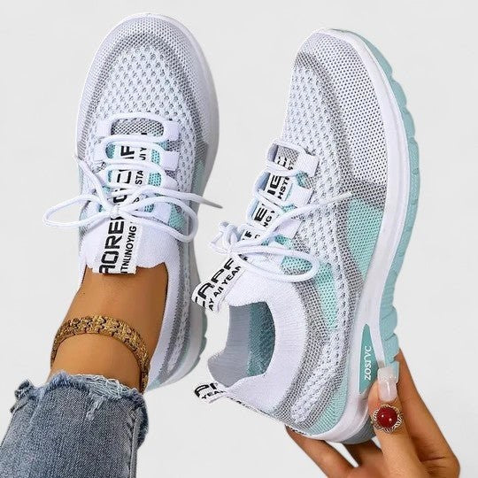White mesh trainers with duck-egg blue panels and cushioned sole
