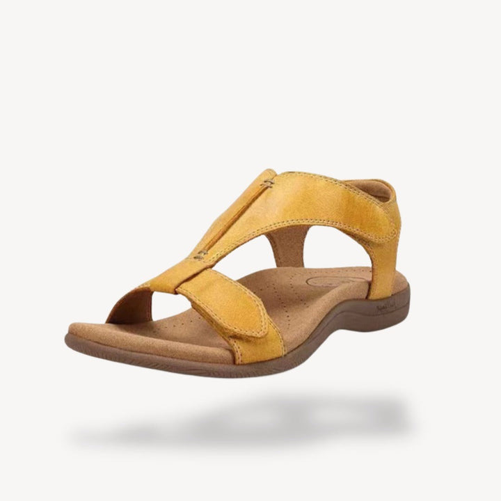 Mustard yellow suede T-strap orthopedic sandal with cushioned footbed and adjustable straps