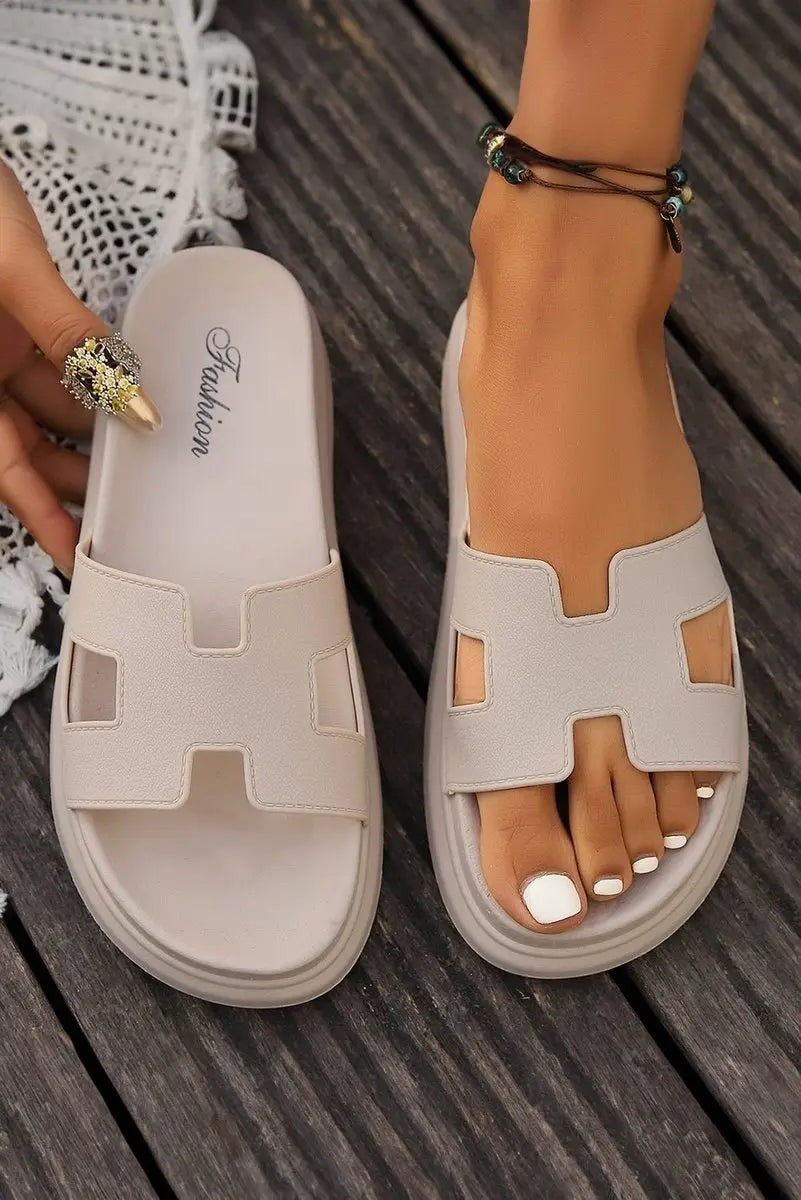 Beige H-strap platform sandals shown flat lay and worn together