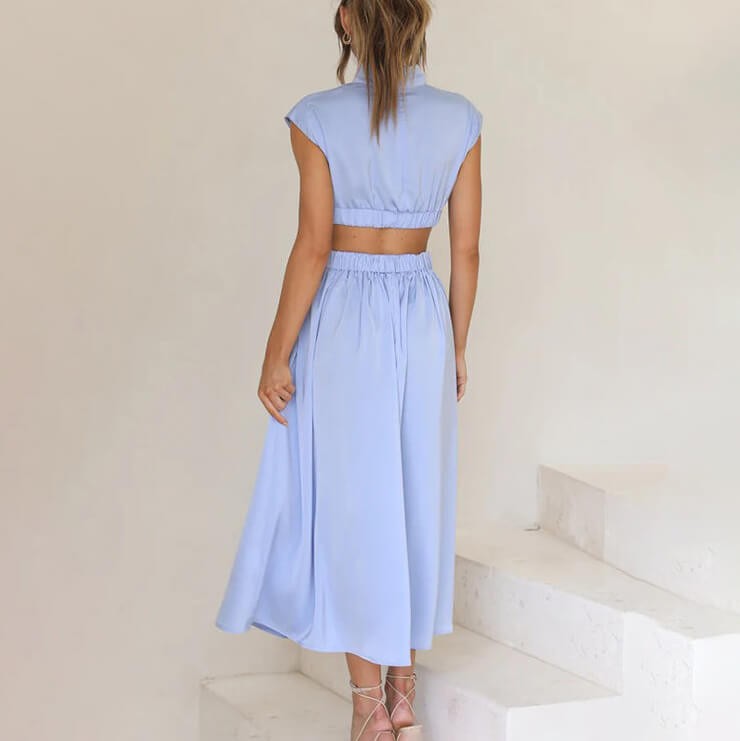 Back view of pale blue midi dress showing elasticated waist detail