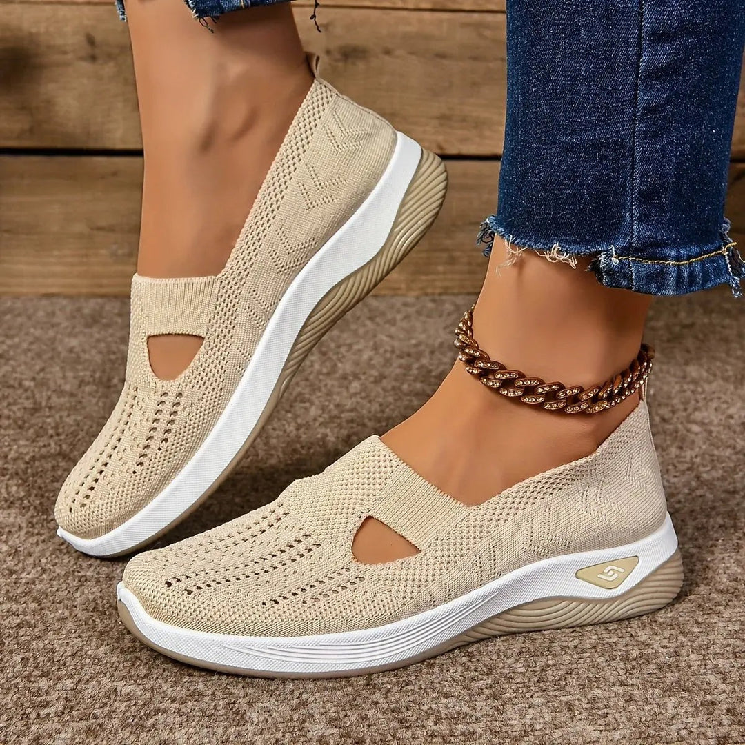 Beige knit slip-on trainers featuring triangular cut-out and platform sole