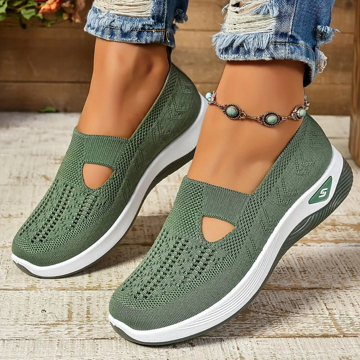 Khaki green mesh slip-on trainers with cut-out design and white wedge sole