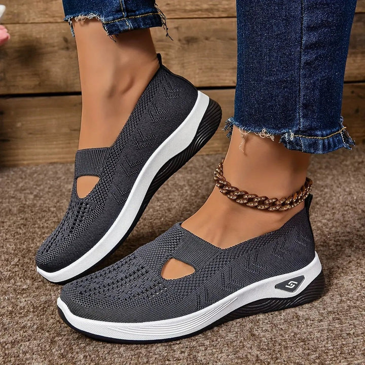 Charcoal grey mesh slip-on trainers with cut-out design and white sole