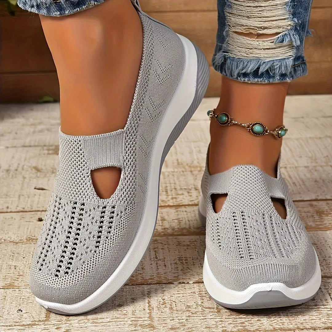 Light grey knitted slip-on trainers with triangular cut-out and platform sole
