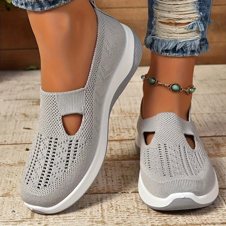 Light grey knitted slip-on trainers with triangular cut-out and platform sole