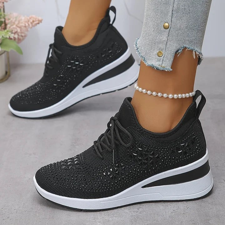 Black knitted wedge trainers with subtle star-shaped rhinestone detailing