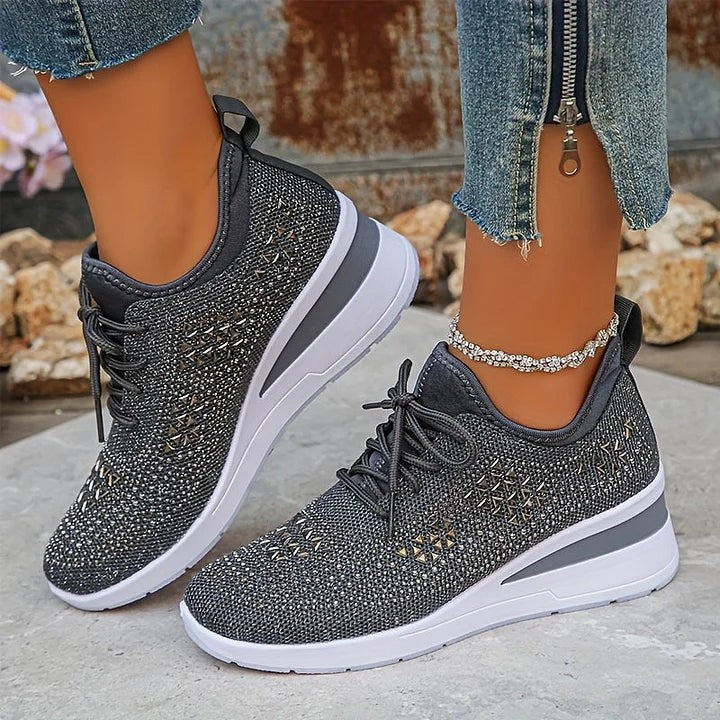 Grey knitted trainers featuring metallic stud and rhinestone detailing