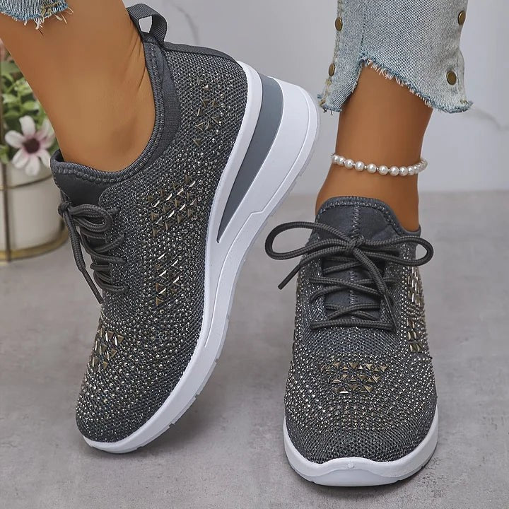 Grey knitted wedge trainers with sparkling geometric embellishments, front view