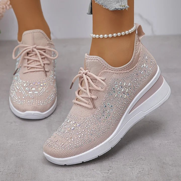 Blush pink knitted wedge trainers showcasing iridescent diamante detailing