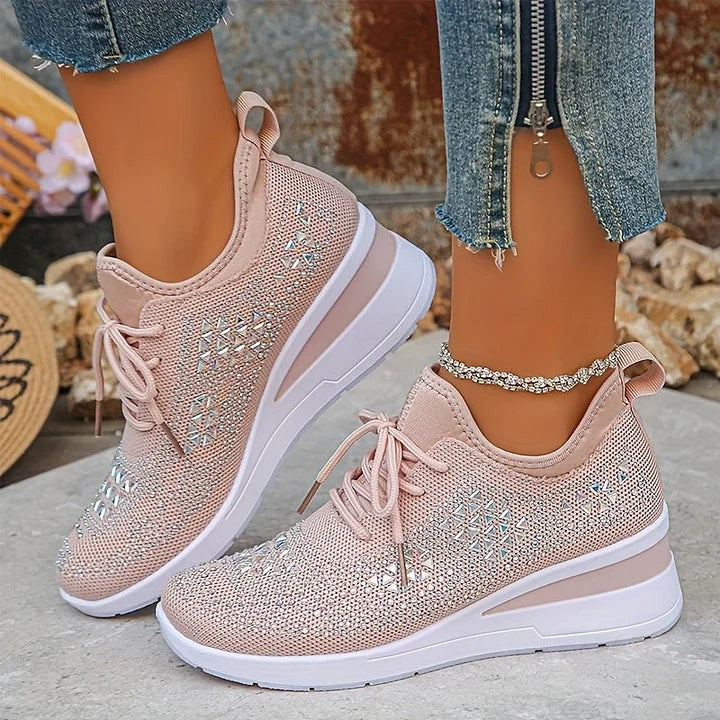 Blush pink knitted trainers with sparkling triangle patterning, close-up view