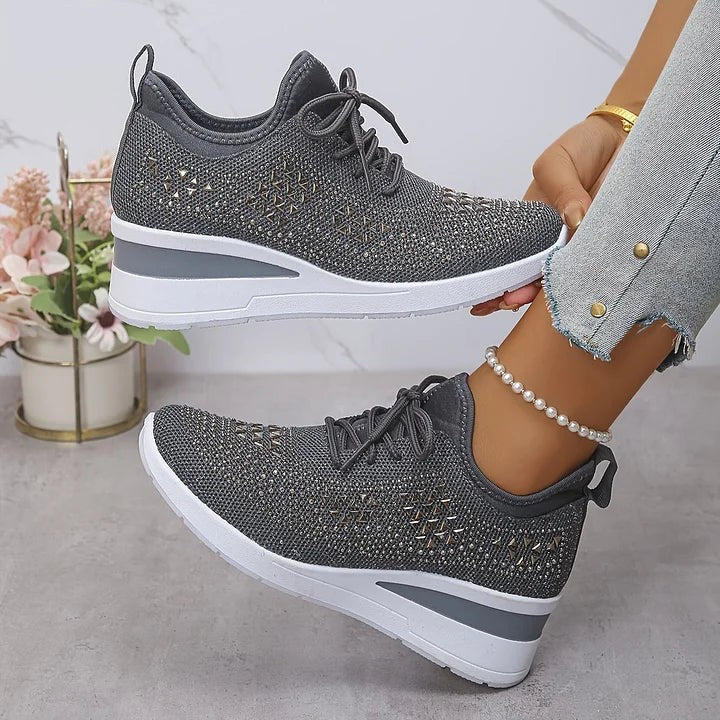 Grey knitted wedge trainers with metallic star-shaped embellishments