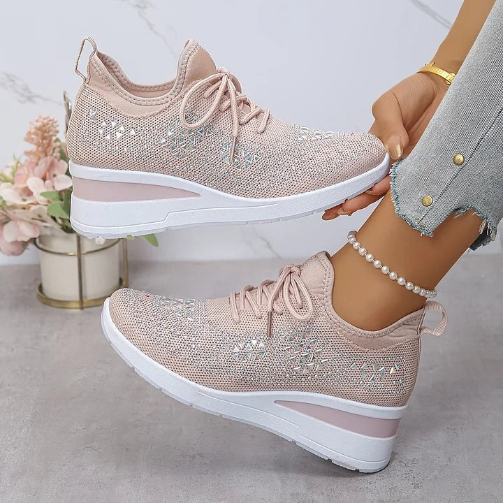 Blush pink knitted trainers adorned with sparkling diamante triangle motifs