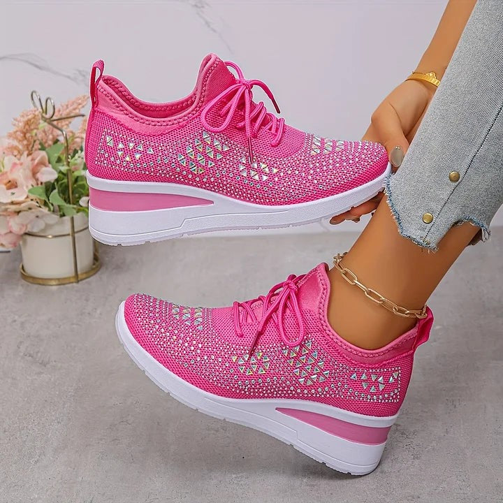 Hot pink knitted trainers featuring iridescent triangle-patterned embellishments