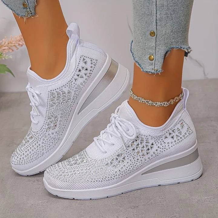 White knitted trainers showcasing sparkling silver triangle patterning
