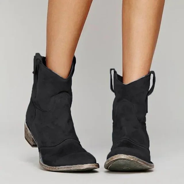 Black suede cowboy-style ankle boots with stacked heel