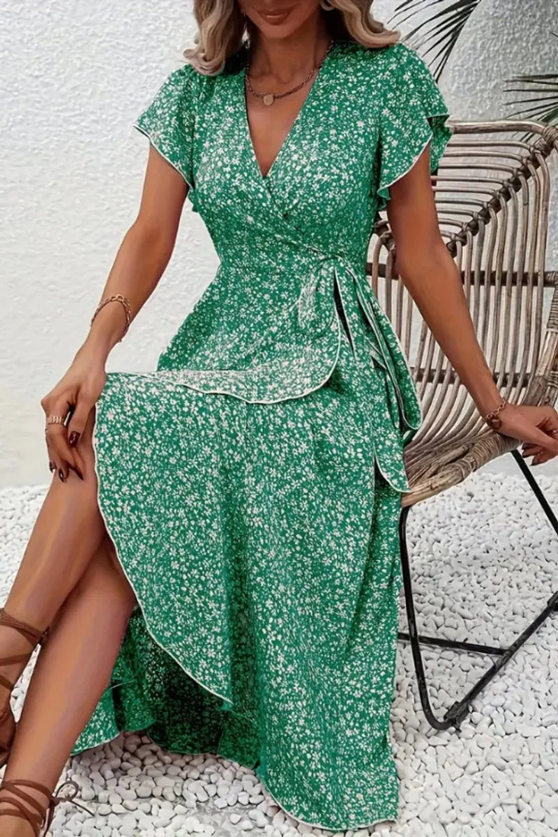 Green floral wrap midi dress with flutter sleeves and side leg split