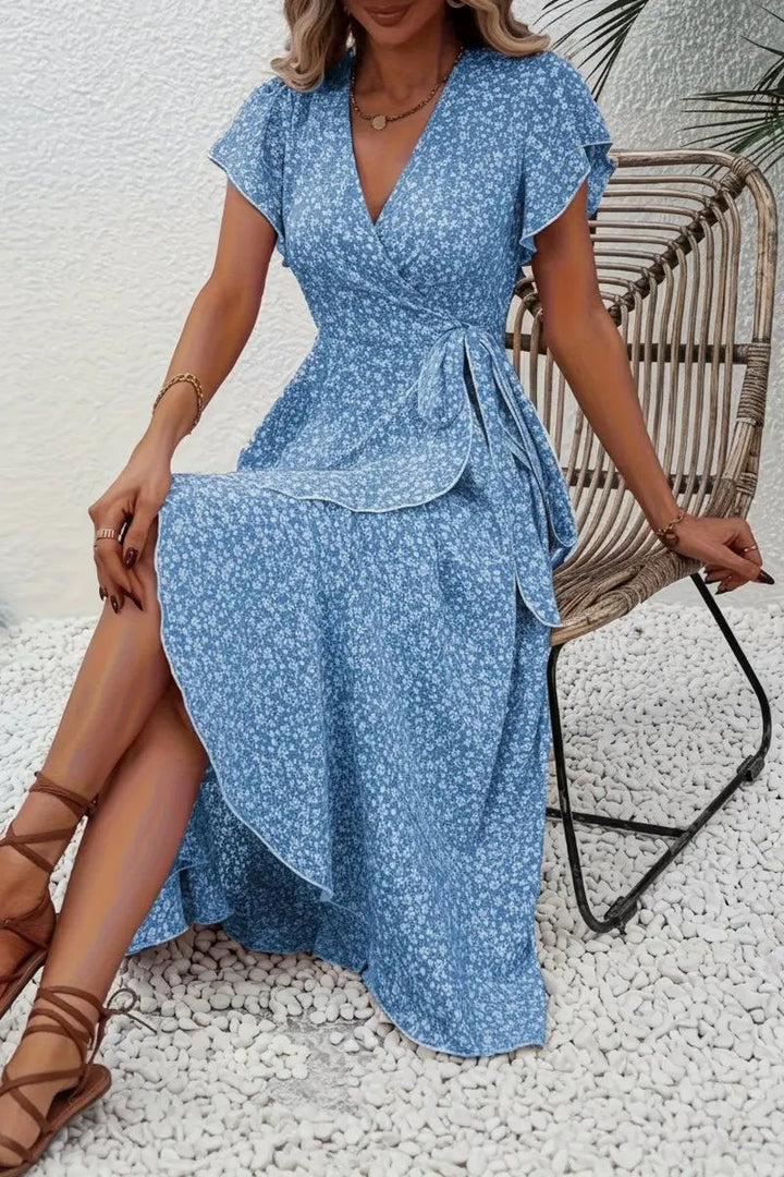Blue floral wrap midi dress with ruffled sleeves and tie-waist design