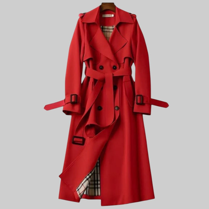 Red double-breasted trench coat featuring buckled cuffs and checked lining