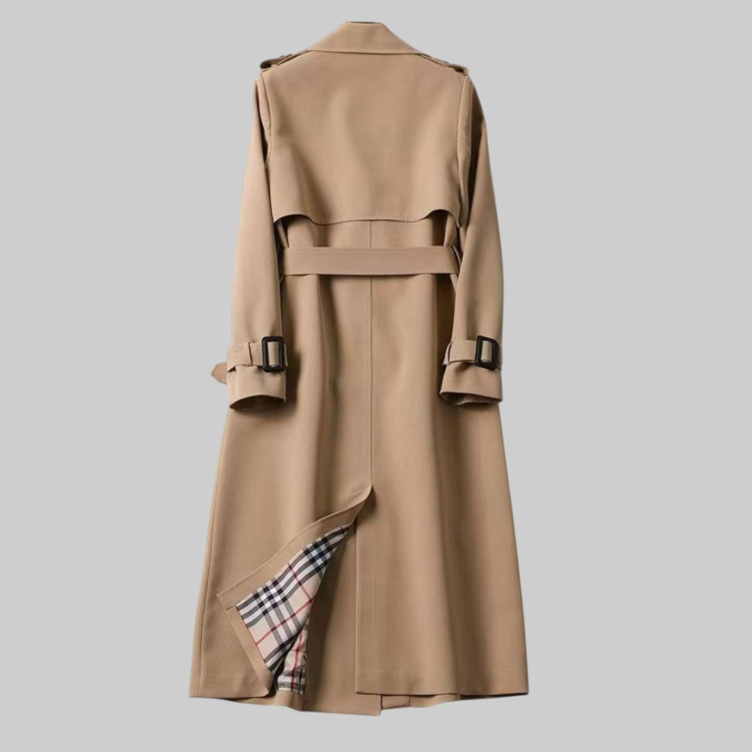 Camel trench coat rear view showing belted waist and tartan hem lining