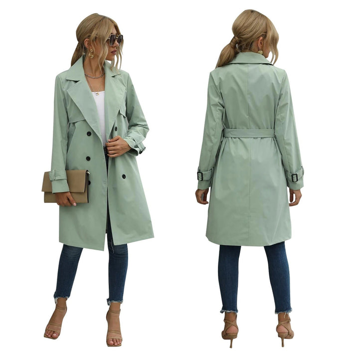 Sage green double-breasted trench coat with belted waist and notch lapel