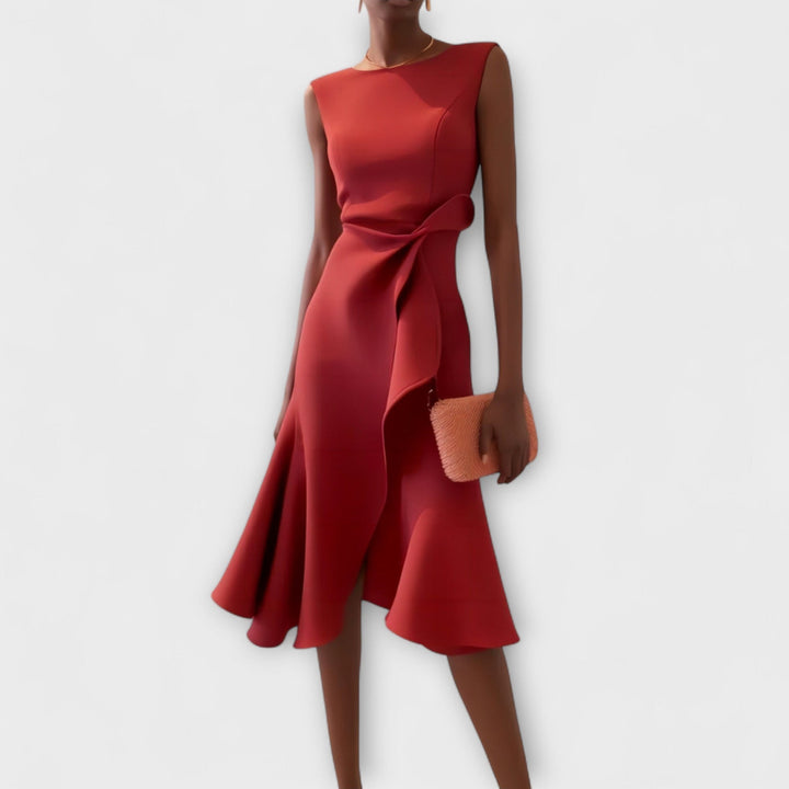 Rust red sleeveless midi dress with draped waist tie and asymmetric hem