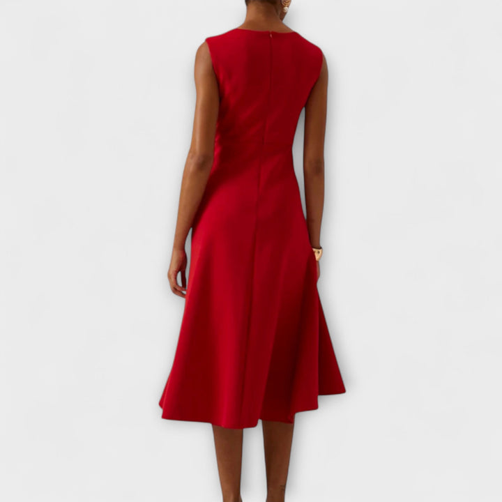 Crimson red sleeveless midi dress shown from behind with flared skirt