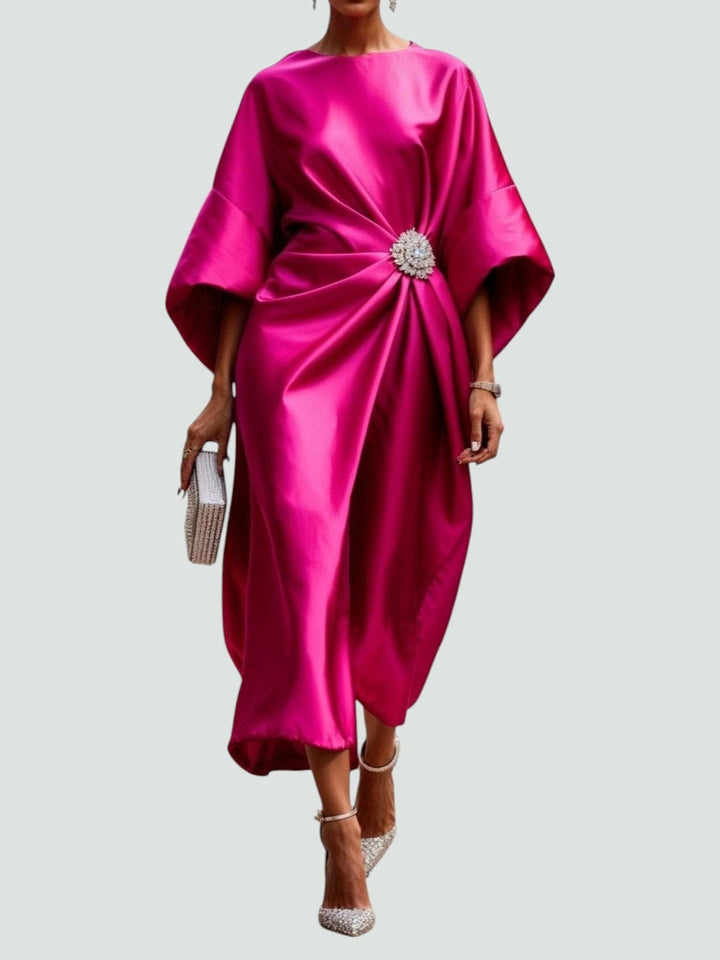 Fuchsia pink satin dress with draped bodice and sparkling brooch accent