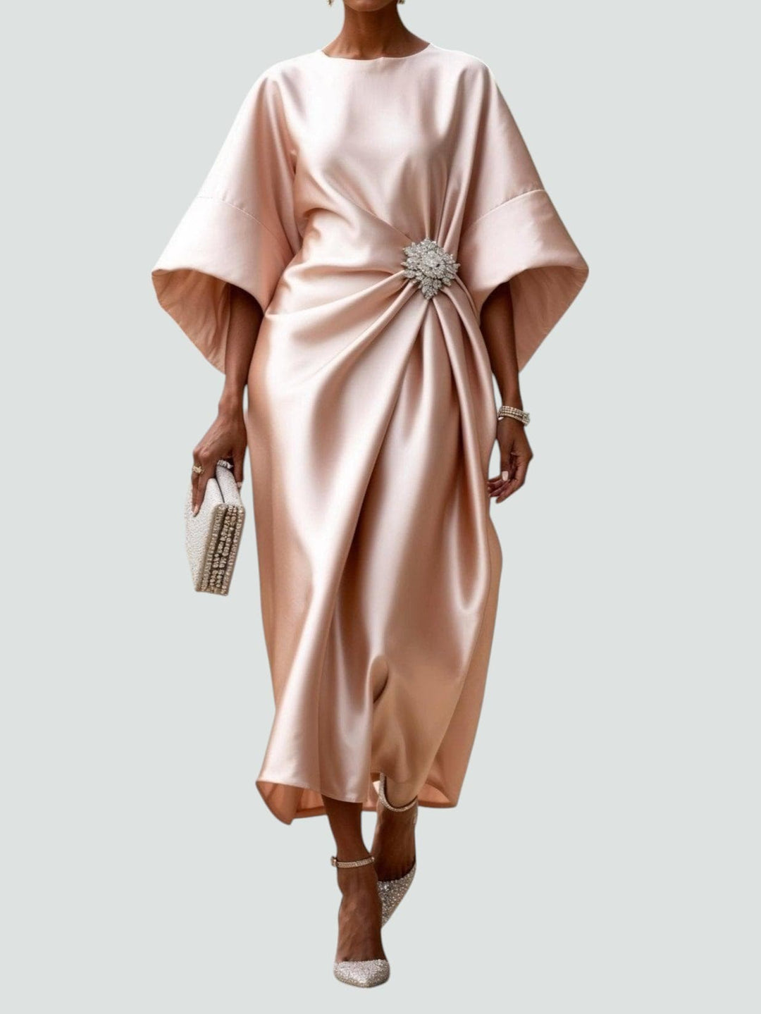 Blush pink satin dress showing kimono sleeves and jewelled waist embellishment