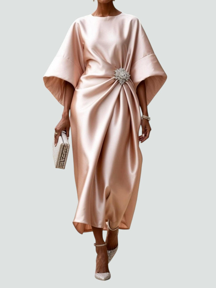 Blush pink satin dress showing kimono sleeves and jewelled waist embellishment