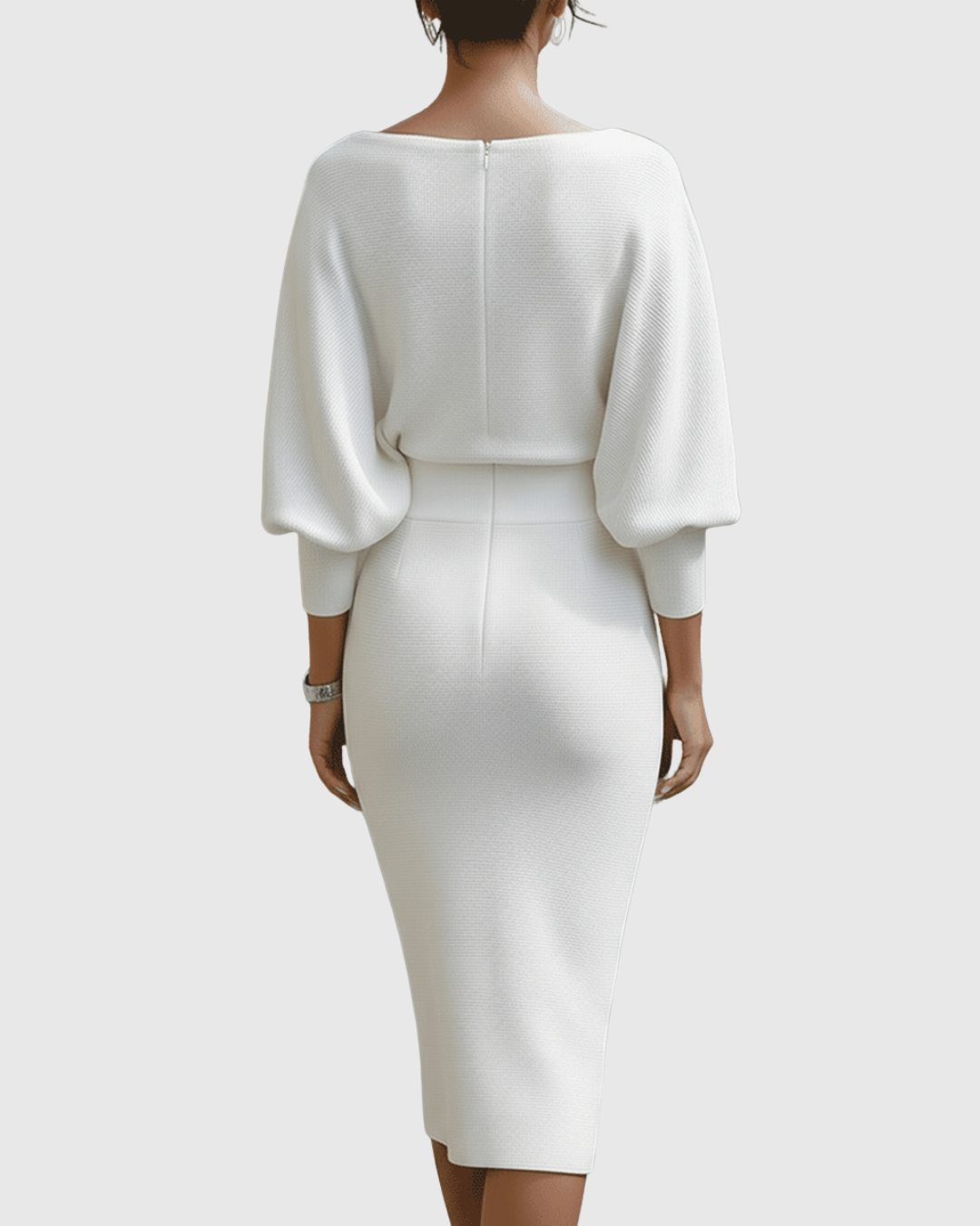 Back view of white batwing midi dress showing fitted waist and pencil skirt